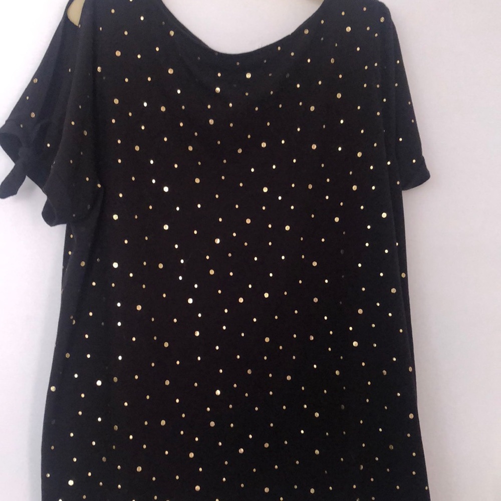 Lane Bryant black top with shiny gold dots all over it. Sleeves are peekaboo.